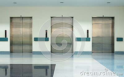 Front View of Three Doors in Elevator Stock Photo