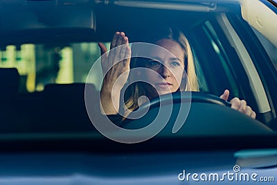 Young frustrated woman driving car Stock Photo