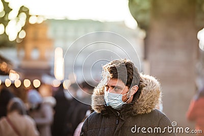 Front view of young lame adult wearing a respiratory mask during the Annual Editorial Stock Photo