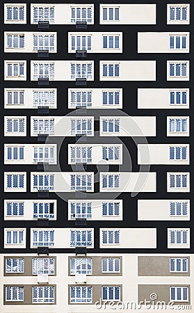 The windows located in the front wall of the modern building form smooth rows of rectangles giving the building an abstract look. Stock Photo