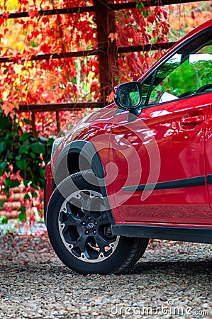 Front wheel with car parts of red Japanese car Subaru XV. Editorial Stock Photo