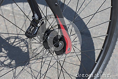 Front wheel of a sports bicycle. Wheel spokes closeup Stock Photo