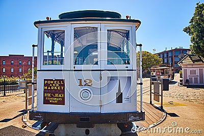 Front of white streetcar 12 at end of path on rotating circular platform with two more behind Editorial Stock Photo