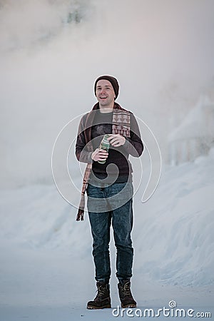 Frost effect hot water freezes man pours boiling water Stock Photo