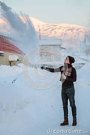 Frost effect hot water freezes man pours boiling water Stock Photo