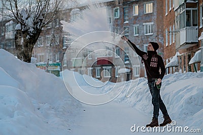 Frost effect hot water freezes man pours boiling water Stock Photo