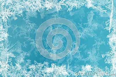 Frost patterns on frozen window as a symbol of Christmas wonder. Christmas or New year background Stock Photo