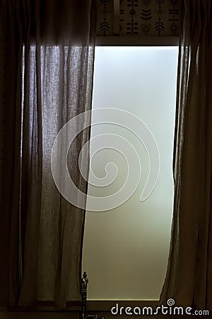 Frosted opaque window with curtains in kitchen. Retro hipster faded style of processing. Grey and gloomy mood Stock Photo