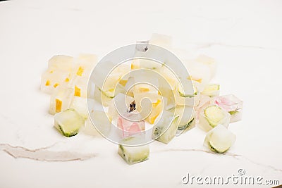 Frosted refreshing vegetable and fruit cubes Stock Photo