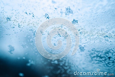 Frosting macro. Cold snow winter background. Blue crystal frozen abstract pattern. White frost ice texture. Stock Photo