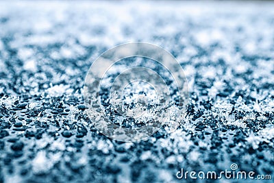 Frosting macro. Cold snow winter background. Blue crystal frozen abstract pattern. White frost ice texture. Stock Photo