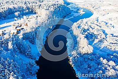 Frosty morning starts in rural area, aerial landscape. Beautiful sunrise over river Stock Photo