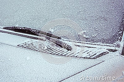Frosty patterns on a completely covered car windscreen Stock Photo