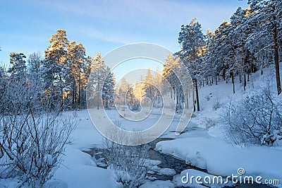 Frosty Sunny morning in the Ural forest, a river, Russia Stock Photo