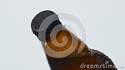 Frothy alcohol drink flask closeup. Ipa beverage inside sweating brown vessel Stock Photo