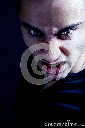 Frown of scary sinister evil vampire man Stock Photo