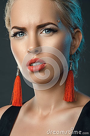 Frowning blonde, trendy studio portrait Stock Photo