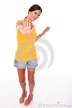 Frowning brunette woman gesturing on white Stock Photo