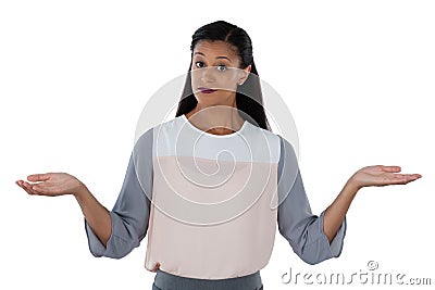 Frowning businesswoman shrugging her shoulders Stock Photo