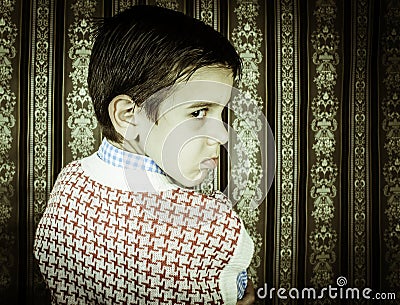 Frowning child vintage clothes. Stock Photo