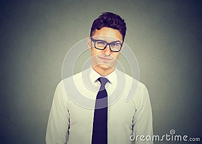 Frowning skeptic man thinking expressing doubts and concerns Stock Photo