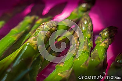 Frozen asparagus stems in water Stock Photo