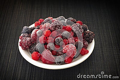 Frozen berries on a plate Stock Photo