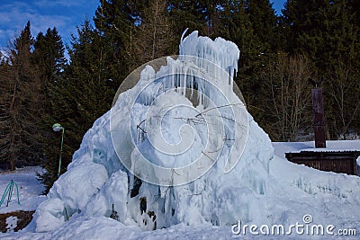 Frozen blue waterfall in the mountains, Slovakia Stock Photo