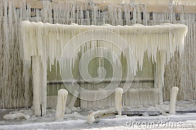 Frozen breakwater and bus stop after winter storm Stock Photo