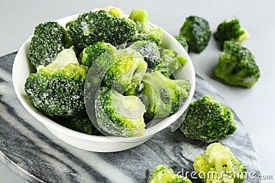 Frozen broccoli florets on table, closeup. Vegetable preservation Stock Photo