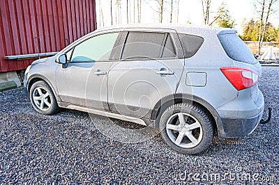 Frozen car parked on gravel Stock Photo