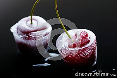 Frozen cherries in ice cubes Stock Photo