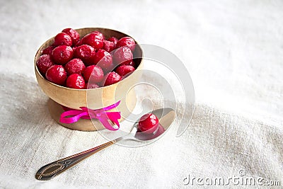 Frozen cherries in a wooden bowl Stock Photo