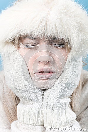 Frozen. Chilled female face covered in ice. Stock Photo