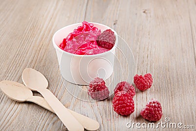 Frozen creamy ice yoghurt with whole raspberries Stock Photo