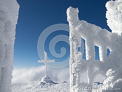 Frozen cross in the mountain Stock Photo