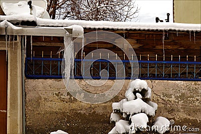 Frozen Downspout. Common issue your gutter may encounter during winter Stock Photo