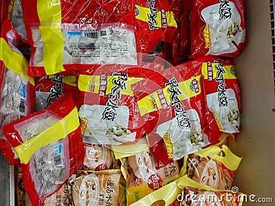 Frozen dumplings in the freezer in the supermarket Editorial Stock Photo