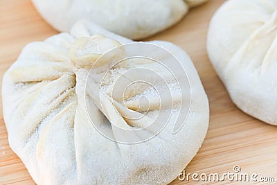 Frozen dumplings or khinkali stuffed with meat ready for boiling Stock Photo