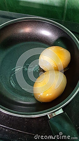 Frozen Eggs in Fry Pan Stock Photo