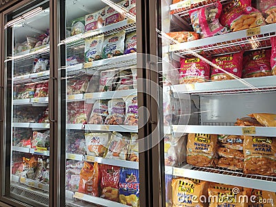 Frozen food displayed on the rack inside the large chiller in the supermarket. Editorial Stock Photo