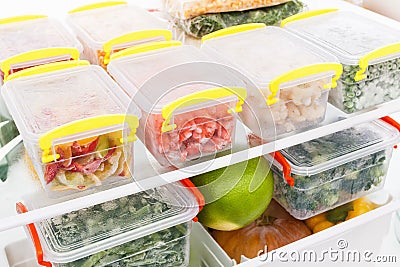 Frozen food in the refrigerator. Vegetables on the freezer shelves. Stock Photo