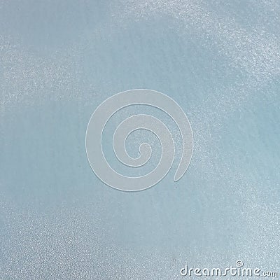 Frost on the metal surface of the car with a blue blur effect. Abstract background and texture for design. Stock Photo