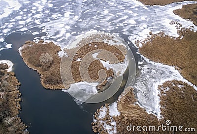 Frozen ice on the shore of the sea as a background, a bird`s-eye view. Early winter Stock Photo