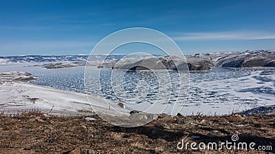 The frozen Lake Baikal is covered with lace-like snow Stock Photo