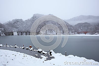 Frozen lake and bridge Stock Photo