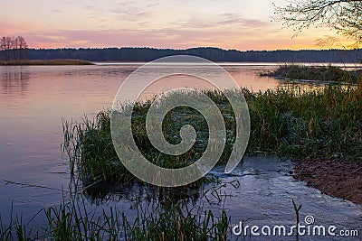 frozen lake with a shore at the rise of an elephant Stock Photo