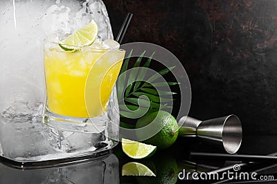 Frozen Lime Cocktail Glass Ice Cube - Ice Melting - Black Background Stock Photo