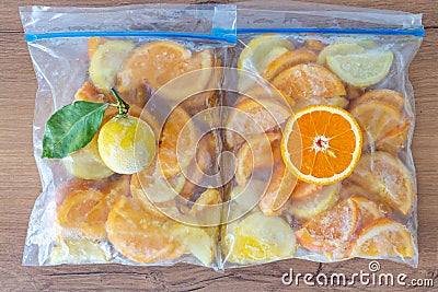 Frozen orange lemon in fridge bag Stock Photo