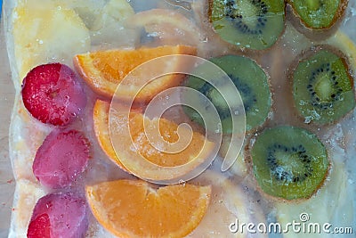 Frozen orange lemon in fridge bag Stock Photo